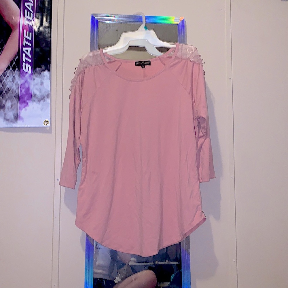 A 1x peach blouse with simple lace sleeves, almost famous.